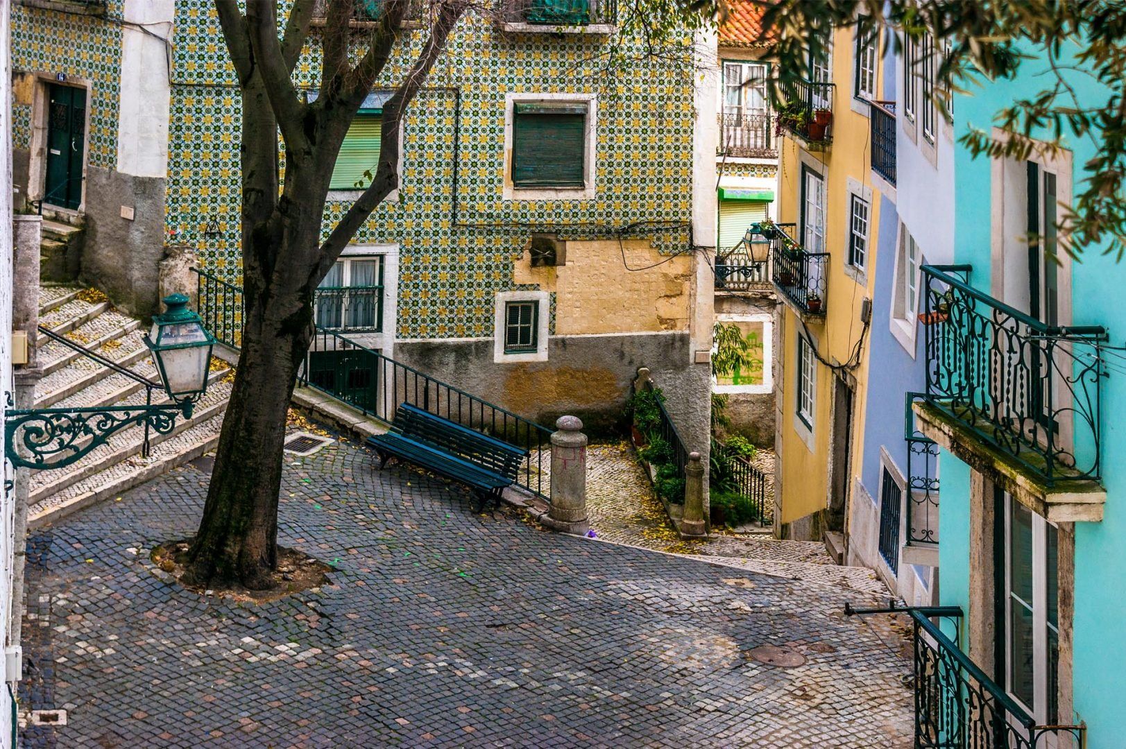 Street and cobblestone floor in the old neighborhood of Alfama, Lisbon © David Evora Marquez/Shutterstock